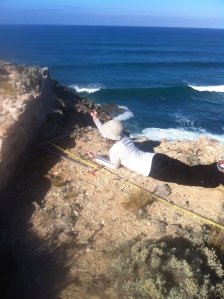 Cataloging artefacts by a remaining wall of the old Port MacDonnell lighthouse