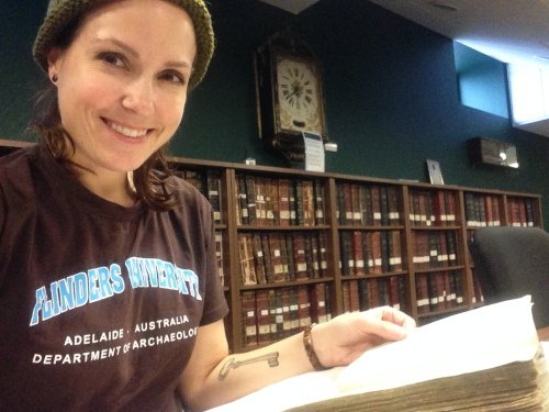 Figure 1. Chelsea Colwell-Pasch reading an original Lloyd’s Register of Shipping at the Glasgow University Archives in Glasgow, Scotland (Photo by: Chelsea Colwell-Pasch).