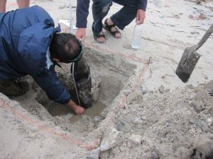 Figure 8. Daniel Petraccaro and Brad Duncan investigate the wooden post. Courtesy of Guy Williams.